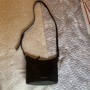 Michael Kors Black Crossbody Bag with adjustable strap.
